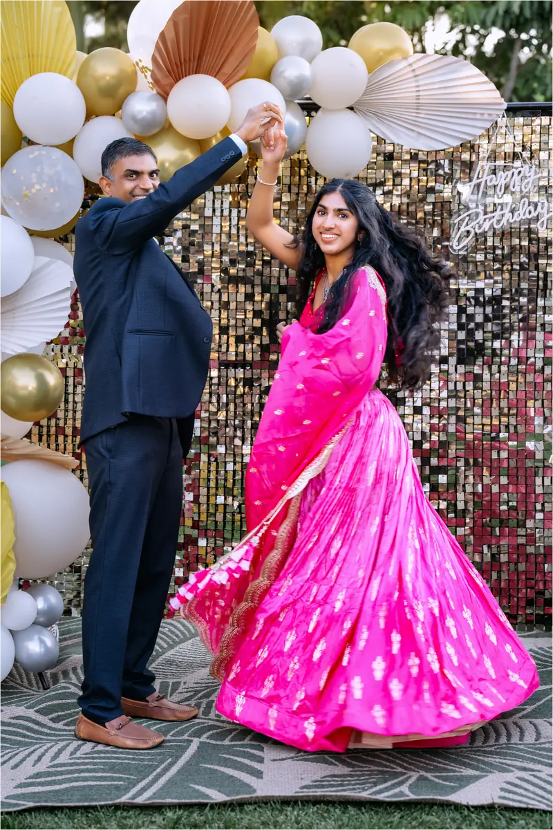 A twirl of pink silk at an engagement party