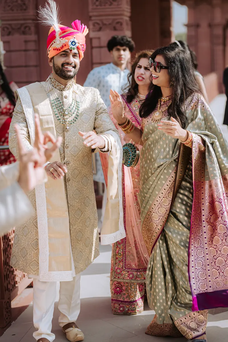 The baraat walks in laughing