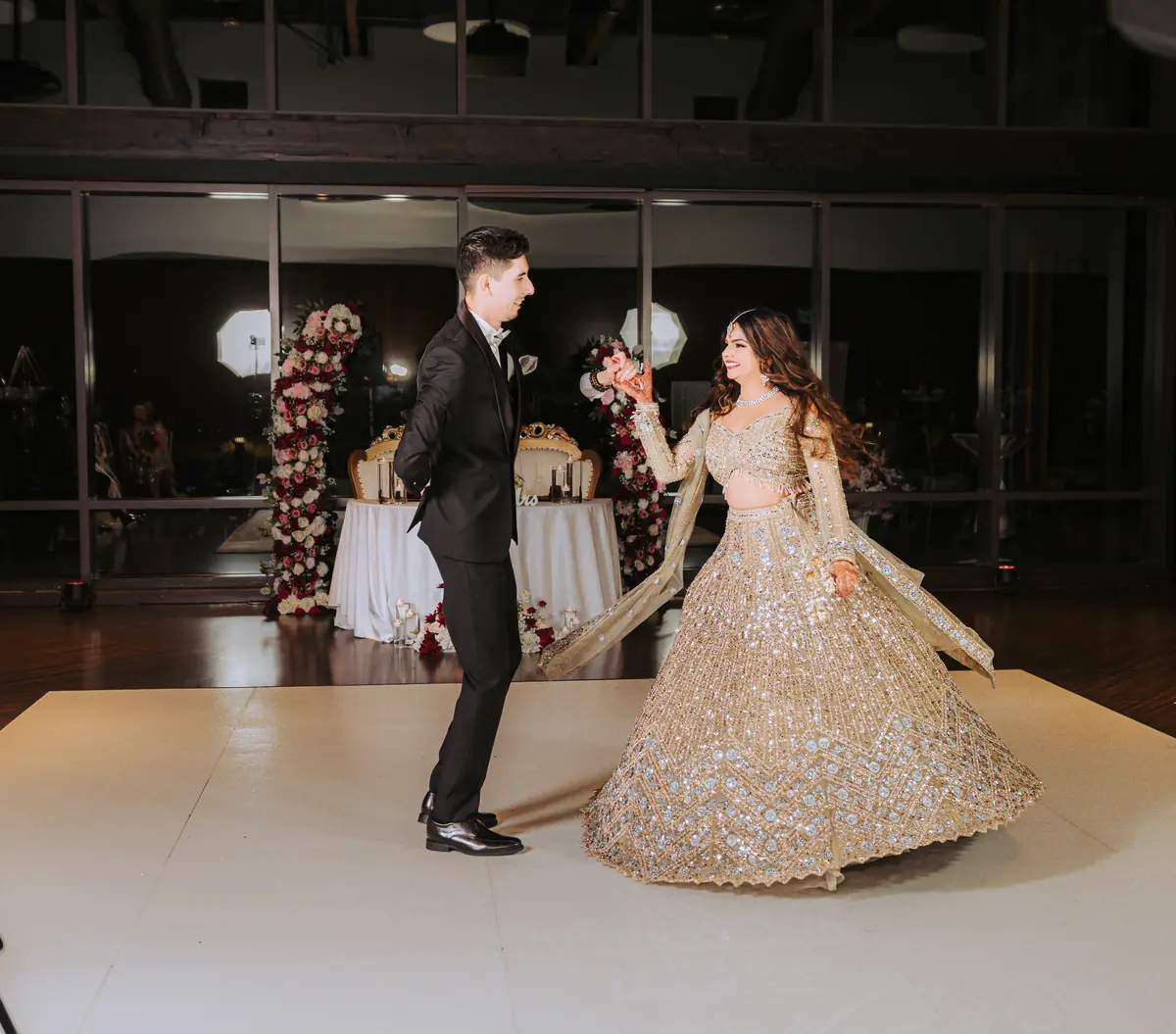 The first dance, framed by candlelight and gathered guests
