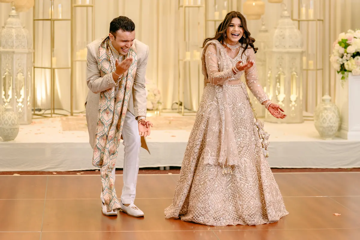 The couple takes the dance floor