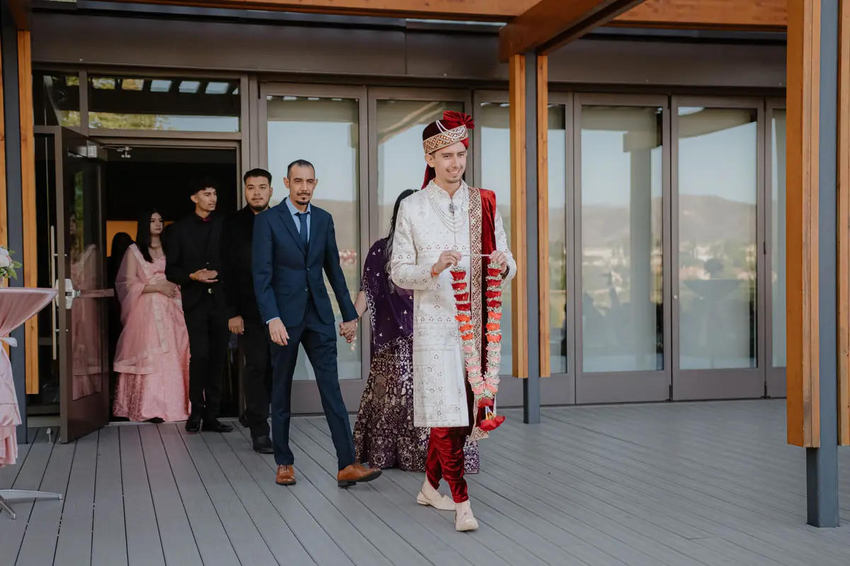 The groom steps out with his crew
