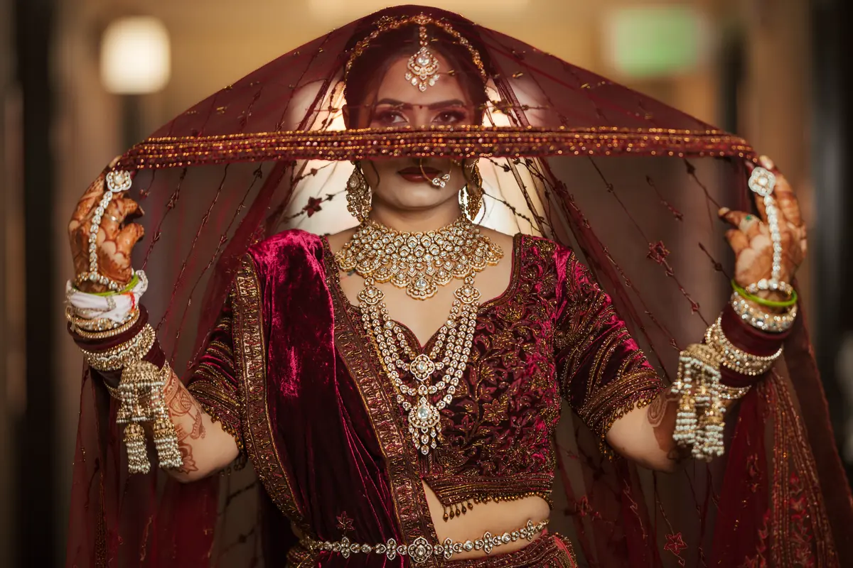 The bride lifting her veil