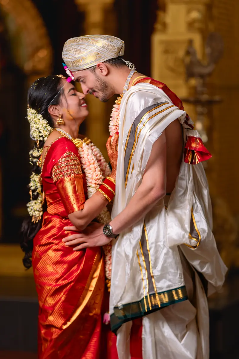 A traditional ceremony in red silk and garlands