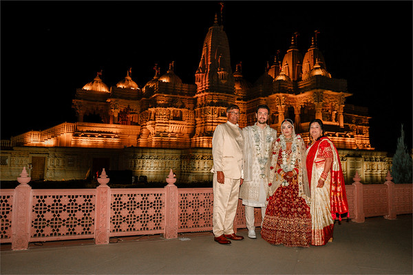With family, the temple lit at dusk