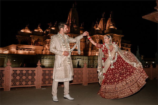 A twirl before the lit temple