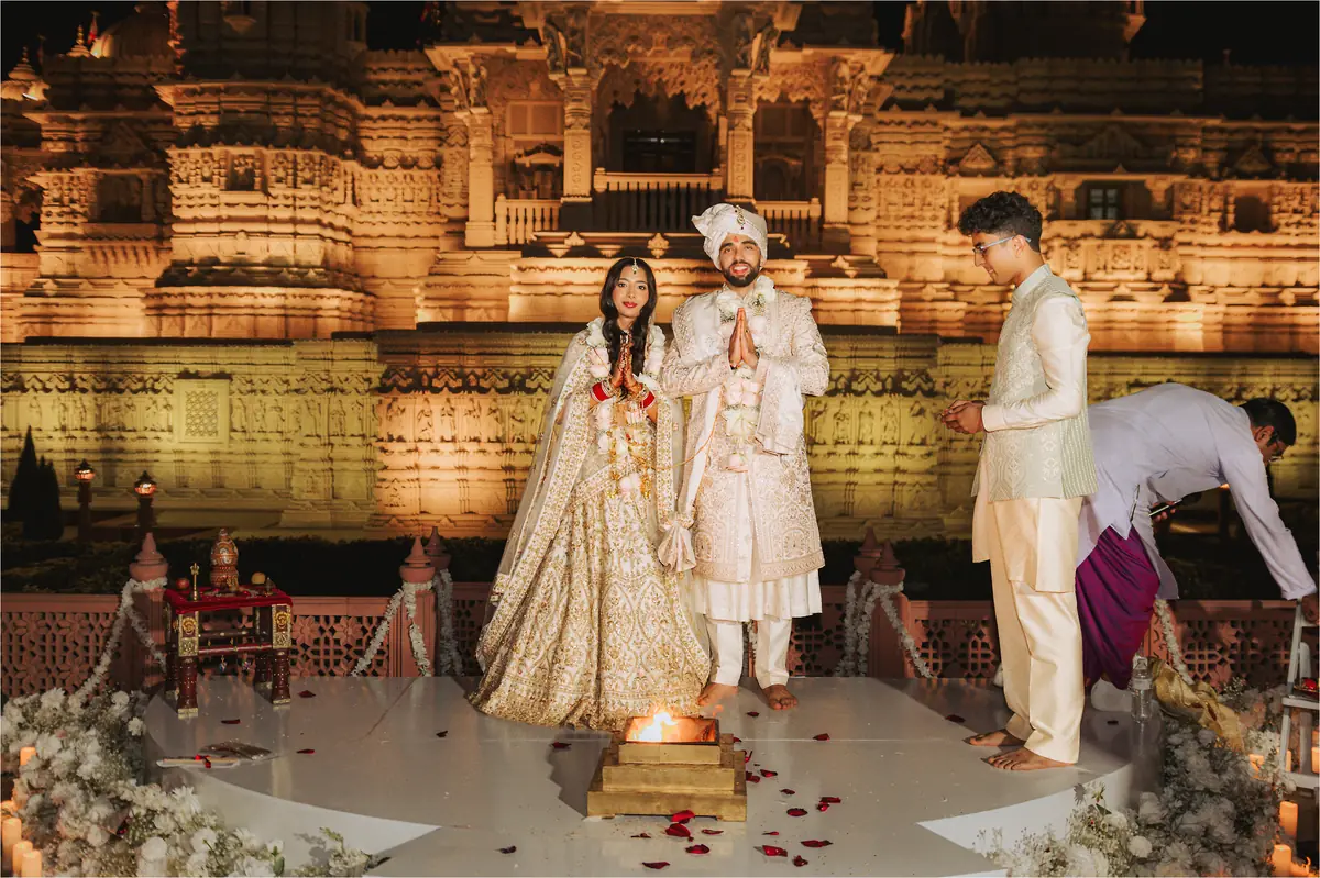 The couple before the lit temple
