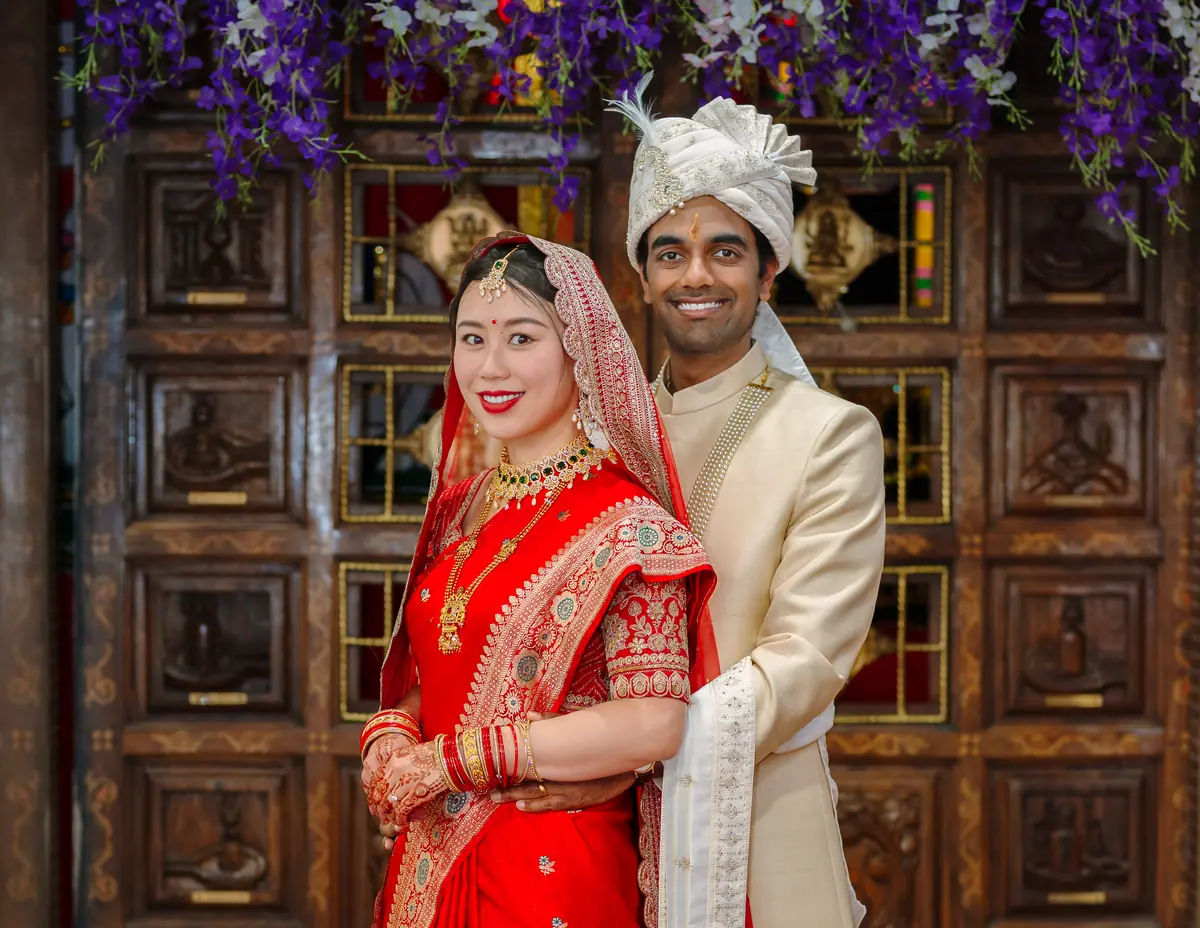 The couple at the carved doors