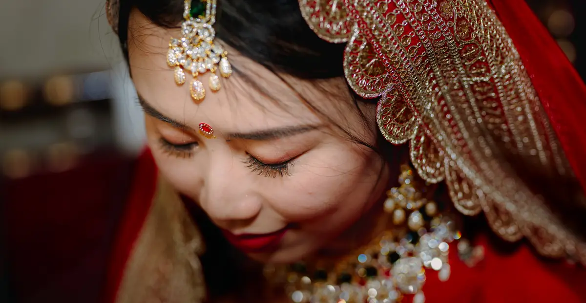 The bride, eyes lowered