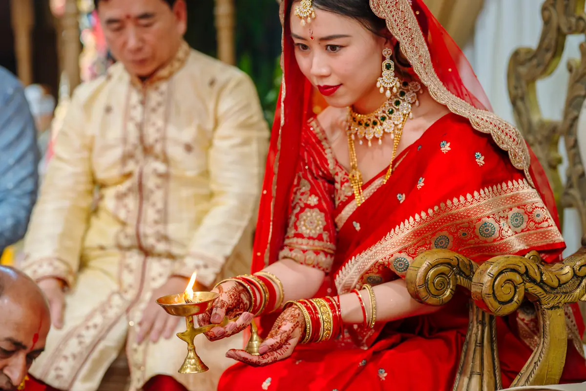 The bride holding the lamp