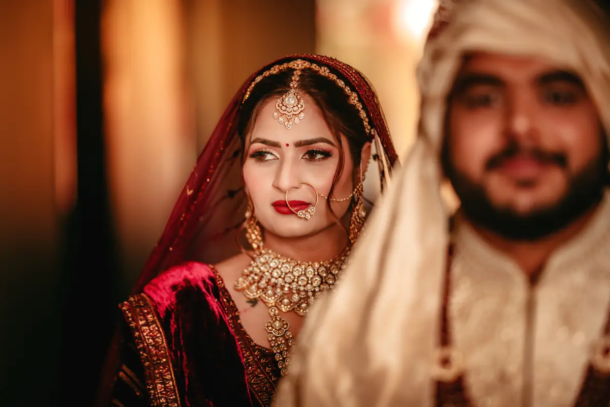 The couple close, veil across