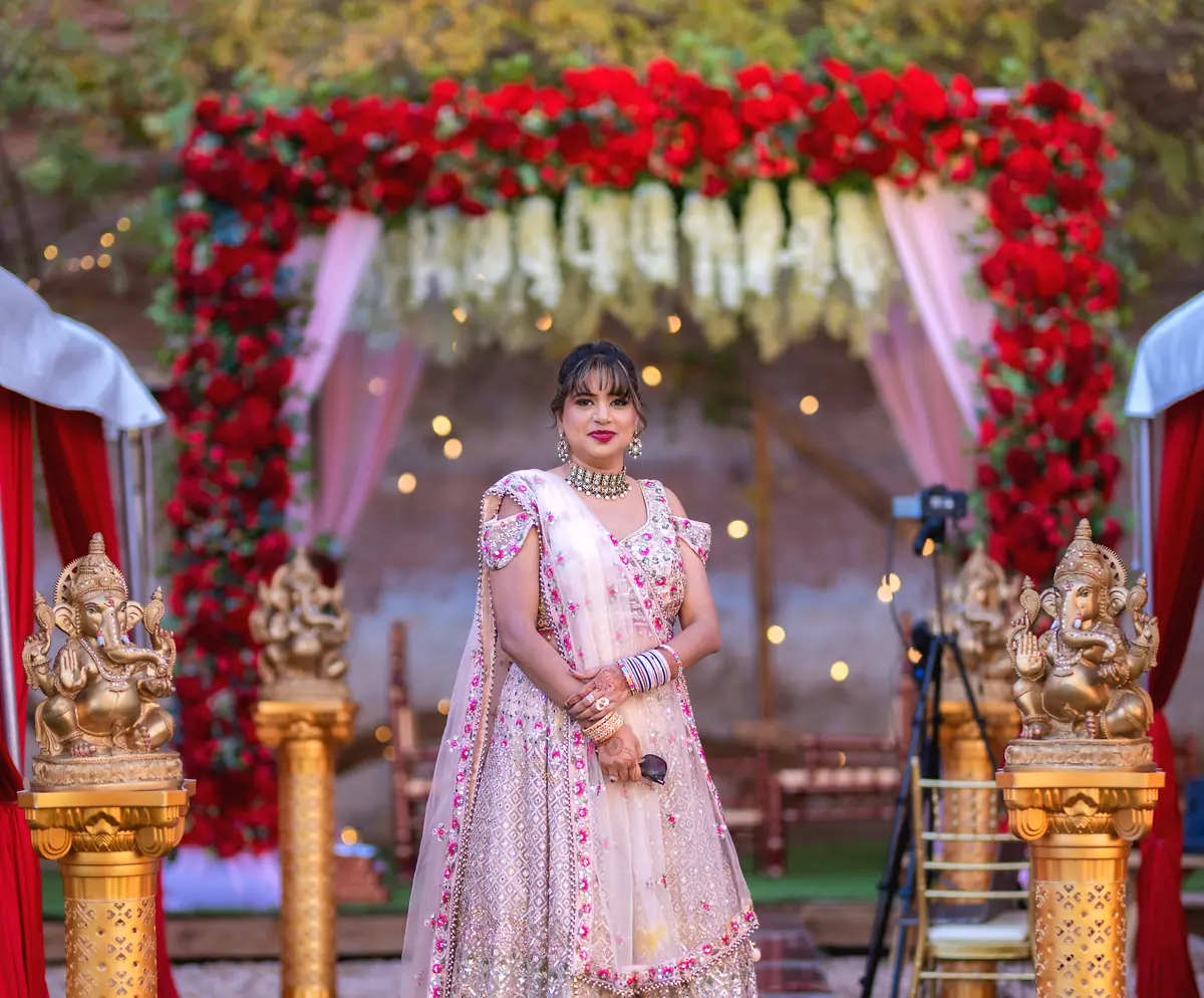 The bride under the flower arch