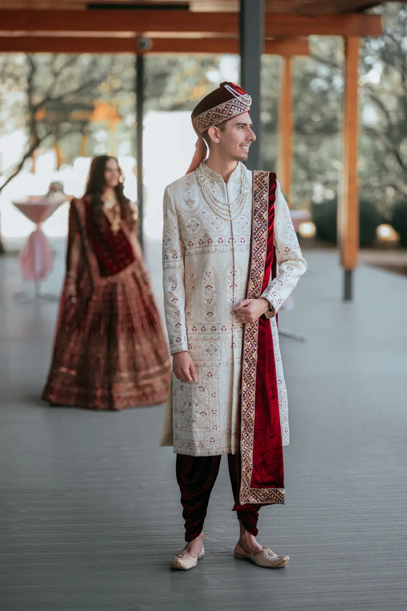 A groom in ivory sherwani before the ceremony